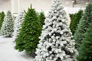 Decorative artificial christmas trees in store